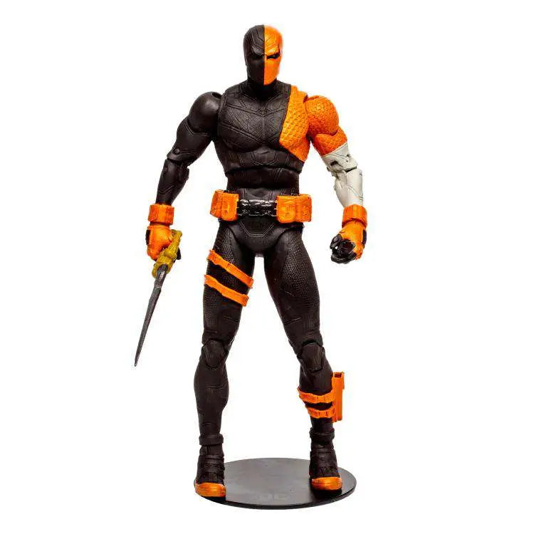 The McFarlane Toys DC Multiverse: Deathstroke – DC Rebirth 7 Inch Scale figure depicts masked Deathstroke in a black and orange armored suit, wielding a sword and standing on a textured round base with vivid orange accessories.