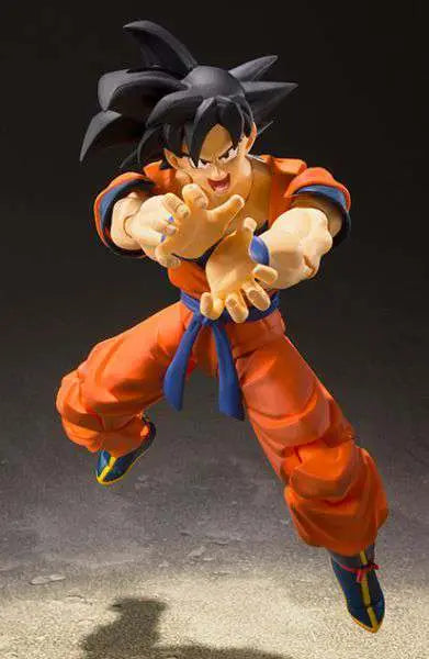 The BANDAI Tamashii Nations S.H.Figuarts Son Goku A Hero Raised on Earth Action Figure (14 cm) features Goku in his iconic orange gi and blue belt, posed mid-air with hands outstretched, ready to launch an energy attack.