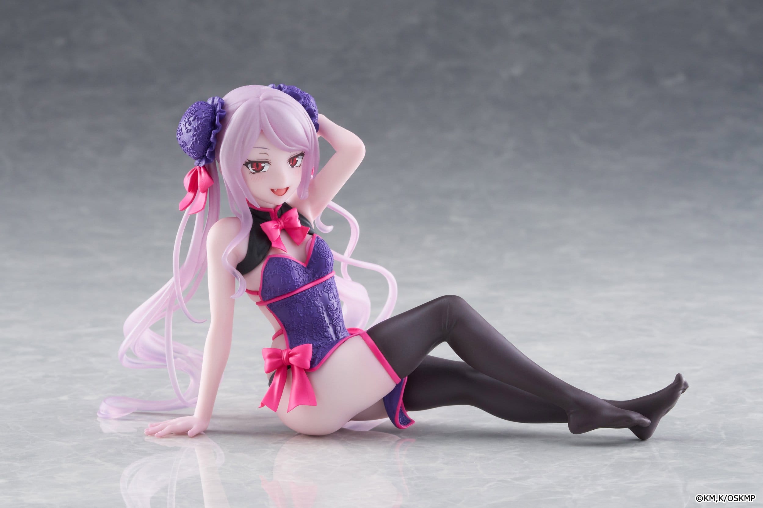 The Taito Desktop Cute Shalltear Chinese Dress Ver. PVC Statue (13 cm) by Taito features an anime-style girl with long lavender hair, purple and pink outfit, and black thigh-highs—an adorable addition to any anime collection.