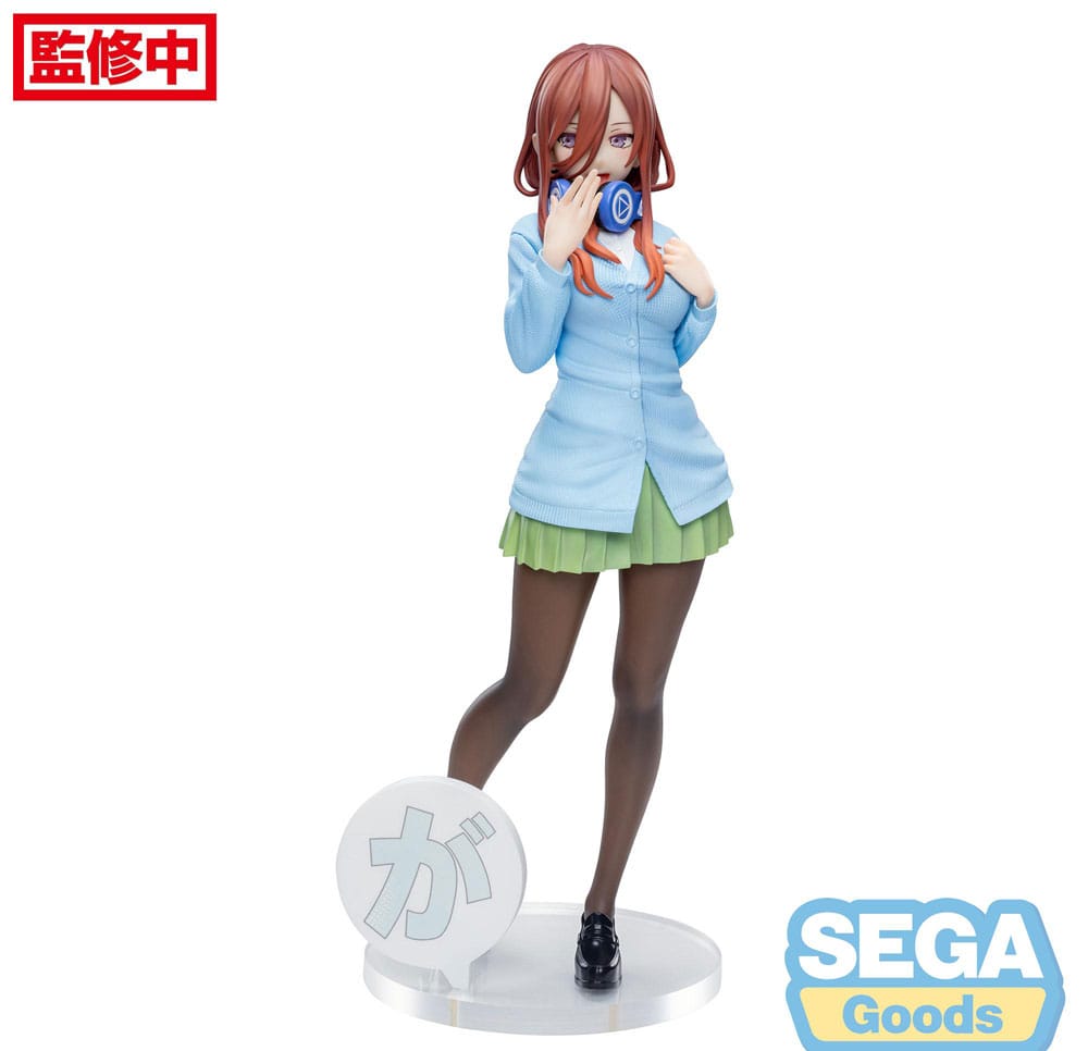 The SEGA The Quintessential Quintuplets Specials Luminasta Miku Nakano PVC Statue (20 cm) features Miku with long red hair, glasses, a blue cardigan over a green skirt, holding a blue object and stands on a display base. SEGA logo is in the bottom right corner.